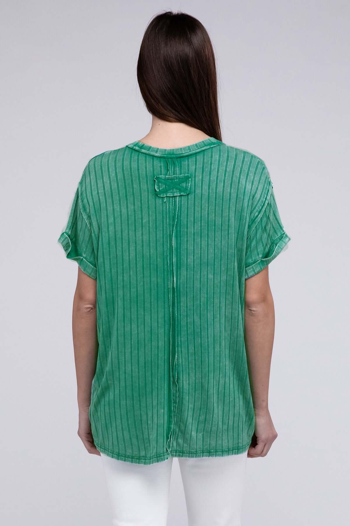 Woman wearing the CAN'T MISS Top by Zenana in kelly green, showcasing ribbed fabric and oversized fit.