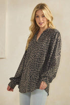 ET7975-14 LONG SLEEVE V NECK ANIMAL URBAN RIB TOP worn by model, featuring a stylish leopard print design.