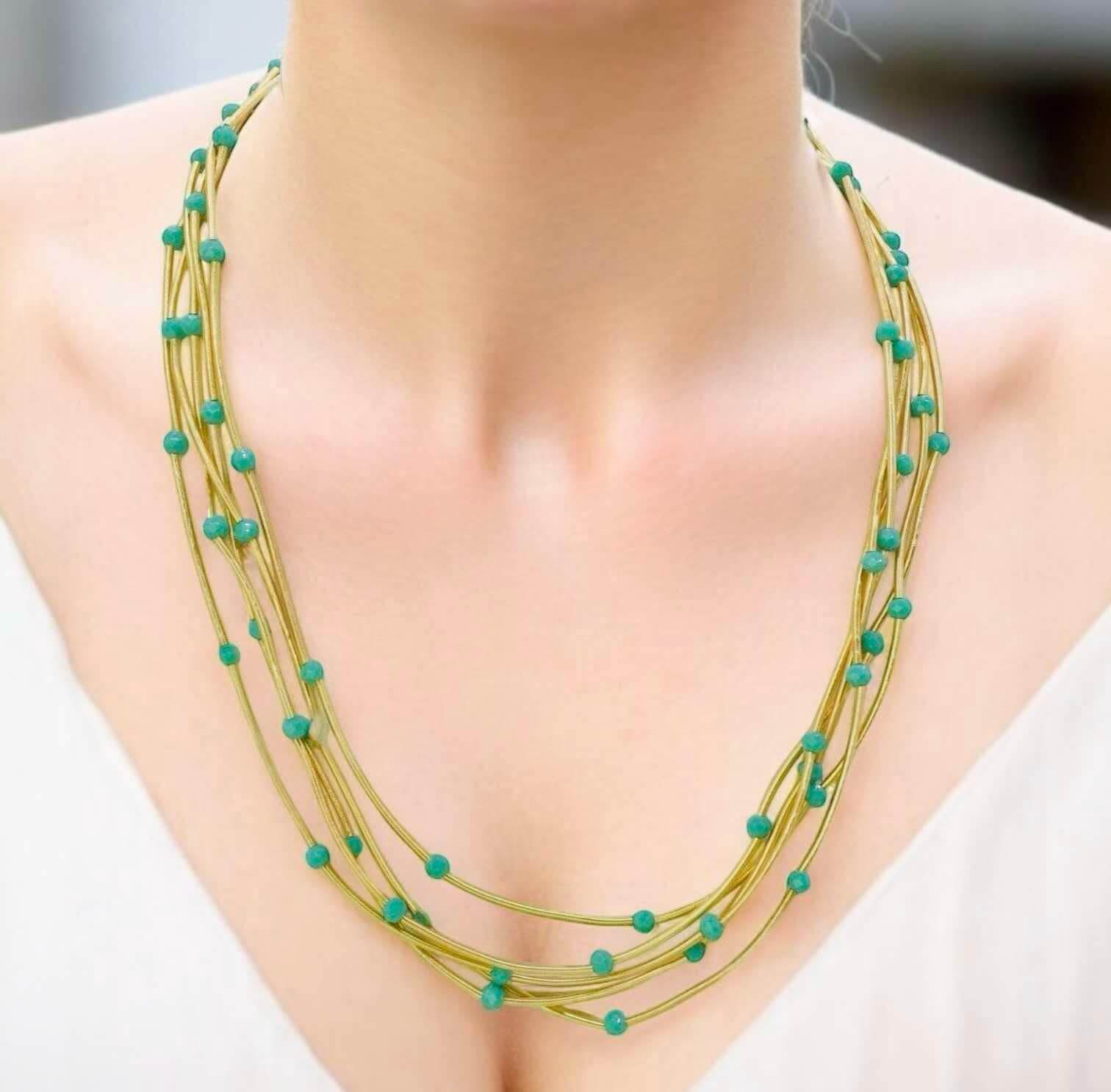 Pretty Strands Necklace by Nine, featuring glass beads on a gold-tone multi-strand design, 22 inches long, adjustable.