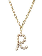 Gold-tone chain monogram necklace with pearl letter pendant from Avenue Zoe.