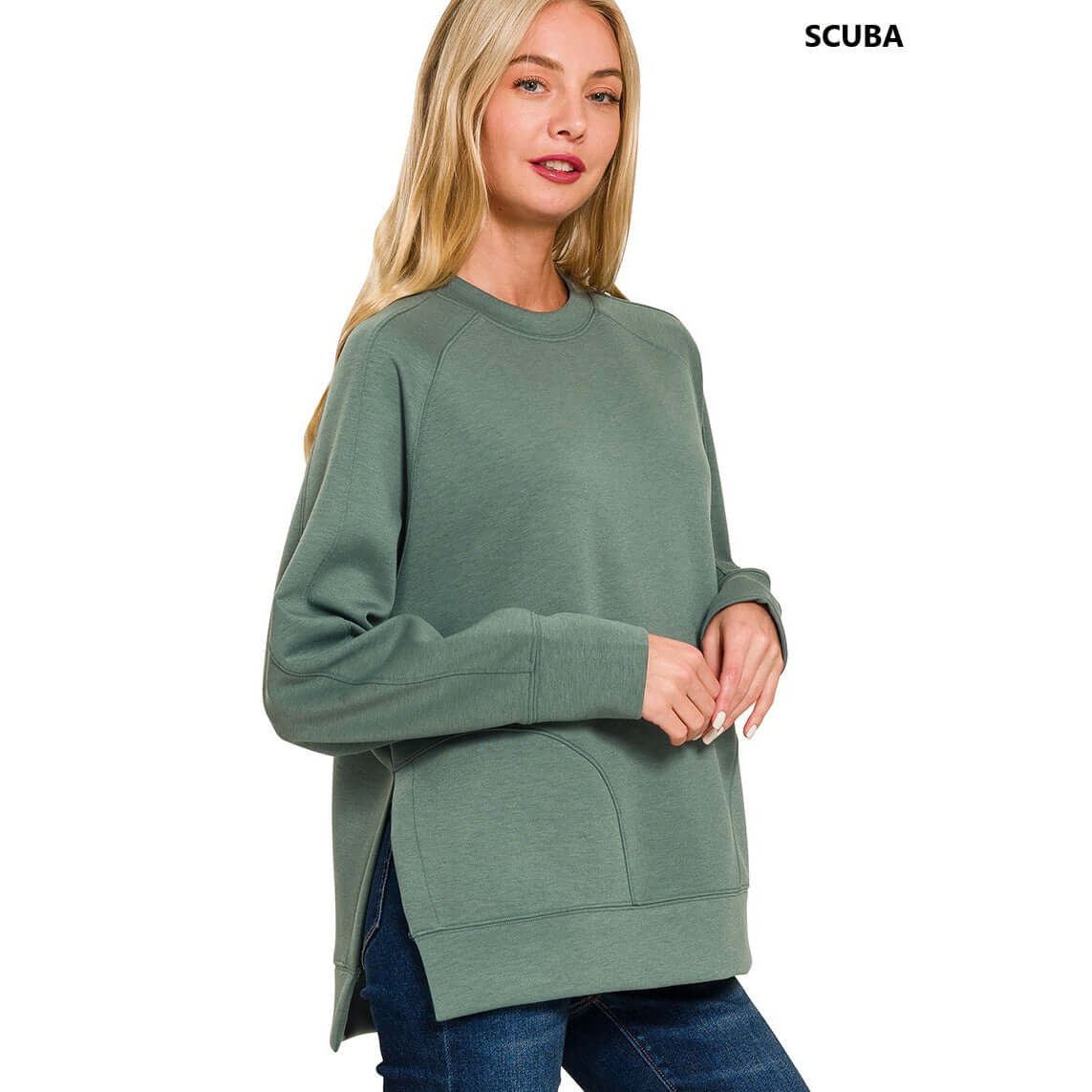 Model wearing the TRANQUIL TRAILS PULLOVER in soft scuba fabric, showcasing side slits and a relaxed fit.