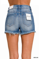 Back view of medium wash denim Barefoot Summer Shorts by Zenana with frayed hem.