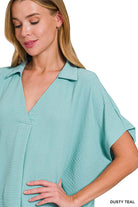 Dusty teal Zenana Gentle Breeze top with collared v-neck and short sleeves, showcasing oversized fit.