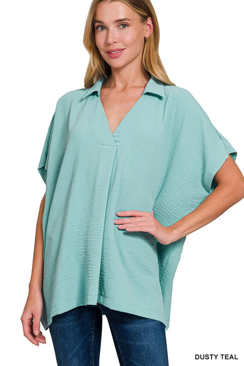 Dusty teal Zenana Gentle Breeze top features a collared v-neck and short sleeves, perfect for a lightweight, oversized fit.