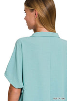 Back view of dusty teal Zenana Gentle Breeze top with short sleeves and collar.