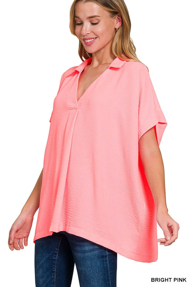 Bright pink Zenana Gentle Breeze top with collared v-neck, short sleeves, and oversized fit.