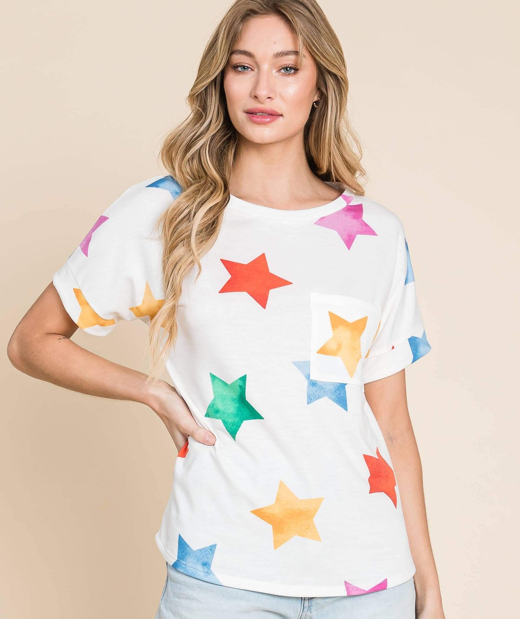 Model wearing the Cosmic Canvas Tee with colorful star prints, designed for comfort and style in everyday wear.