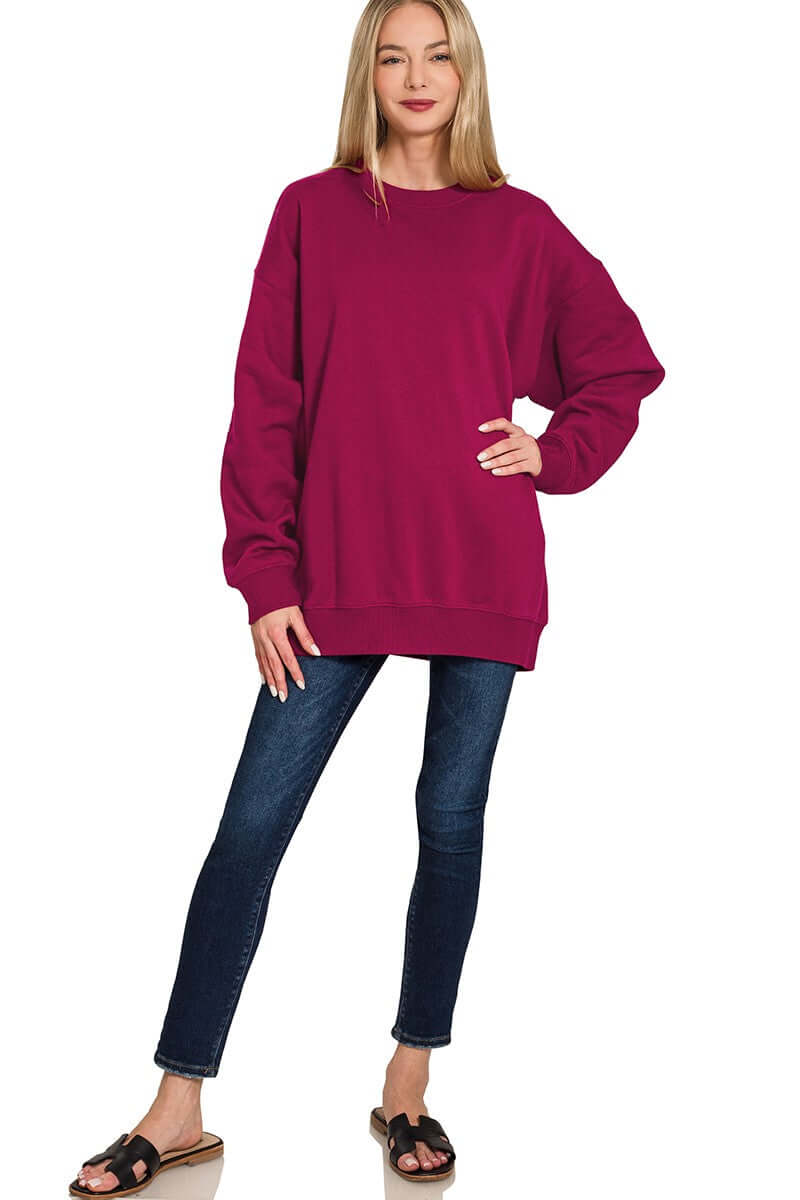 Casual look featuring a model in a bright purple HEARTHSIDE MOMENTS PULLOVER fleece tunic sweatshirt and jeans.