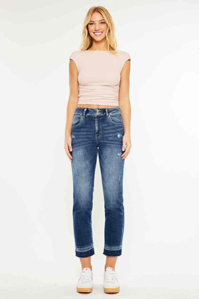 Woman wearing Kancan Georgia Ultra High Rise Slim Straight Leg Jeans with a fitted top and sneakers.
