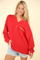 Oversized red contrast hoodie top with button-down front and welt pocket, styled for a casual look. Plus size available.