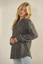 ET7975-14 LONG SLEEVE V NECK ANIMAL URBAN RIB TOP worn by a model with wavy blonde hair posing in a neutral background.