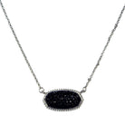 Oval druzy stone pendant necklace with textured design on a silver chain.