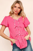 Pink Ribbons & Beaus Top by Haptics features ribbon details, flutter sleeves, and a babydoll silhouette.