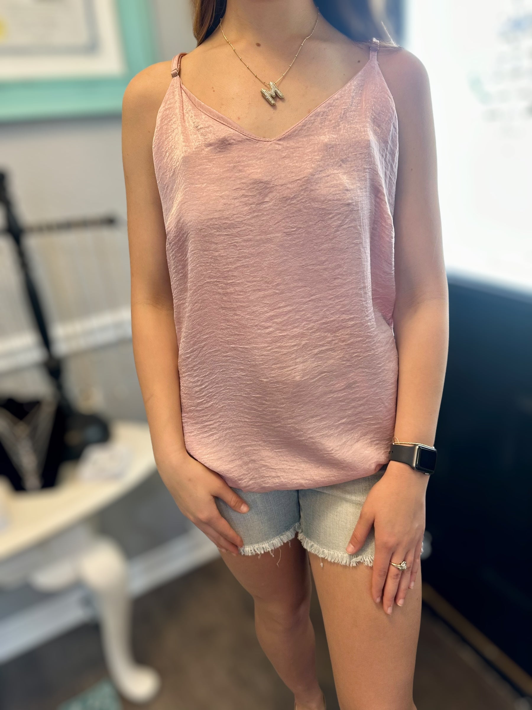 MAGIC FIT Cami in pink worn with denim shorts, showcasing its stylish v-neck design and silky texture.