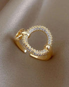 Stunning gold tone CIRCLE UP Cocktail Ring with sparkling Cubic Zirconia, perfect for elegant outfits. Adjustable size for a perfect fit.