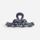 RIBBON REVIVAL HAIR CLIP (7 colors) in matte gray, featuring a bow design that combines style and function.