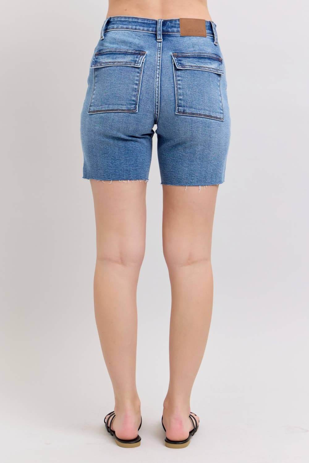 Back view of JUDY BLUE MIDRISE DAKOTA SHORTS showing flap pockets and comfortable fit.