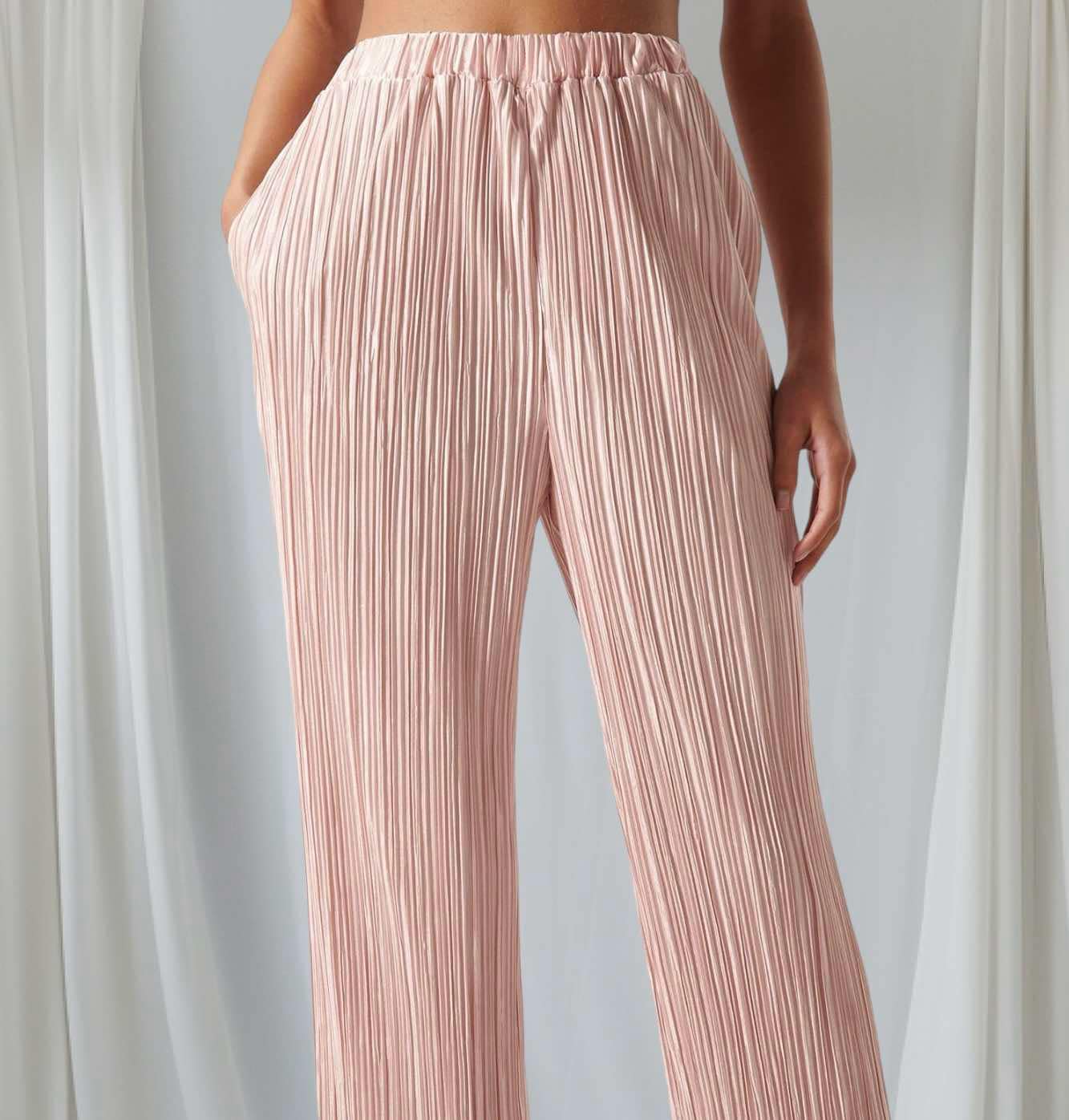 Blush pink Sugarlips Soft Touch pants featuring a high waist and pleated design, perfect for stylish daytime or evening wear.