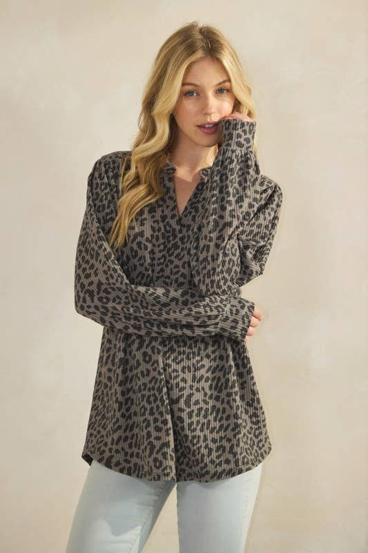 ET7975-14 LONG SLEEVE V NECK ANIMAL URBAN RIB TOP worn by a model showcasing its stylish design.