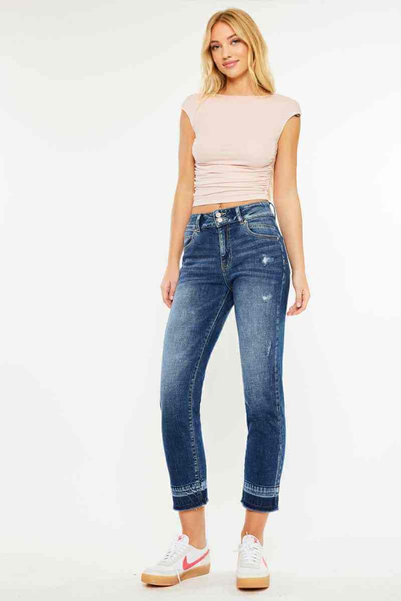 Model wearing Kancan Georgia Ultra High Rise Slim Straight Leg Jeans in dark wash with subtle distressing.