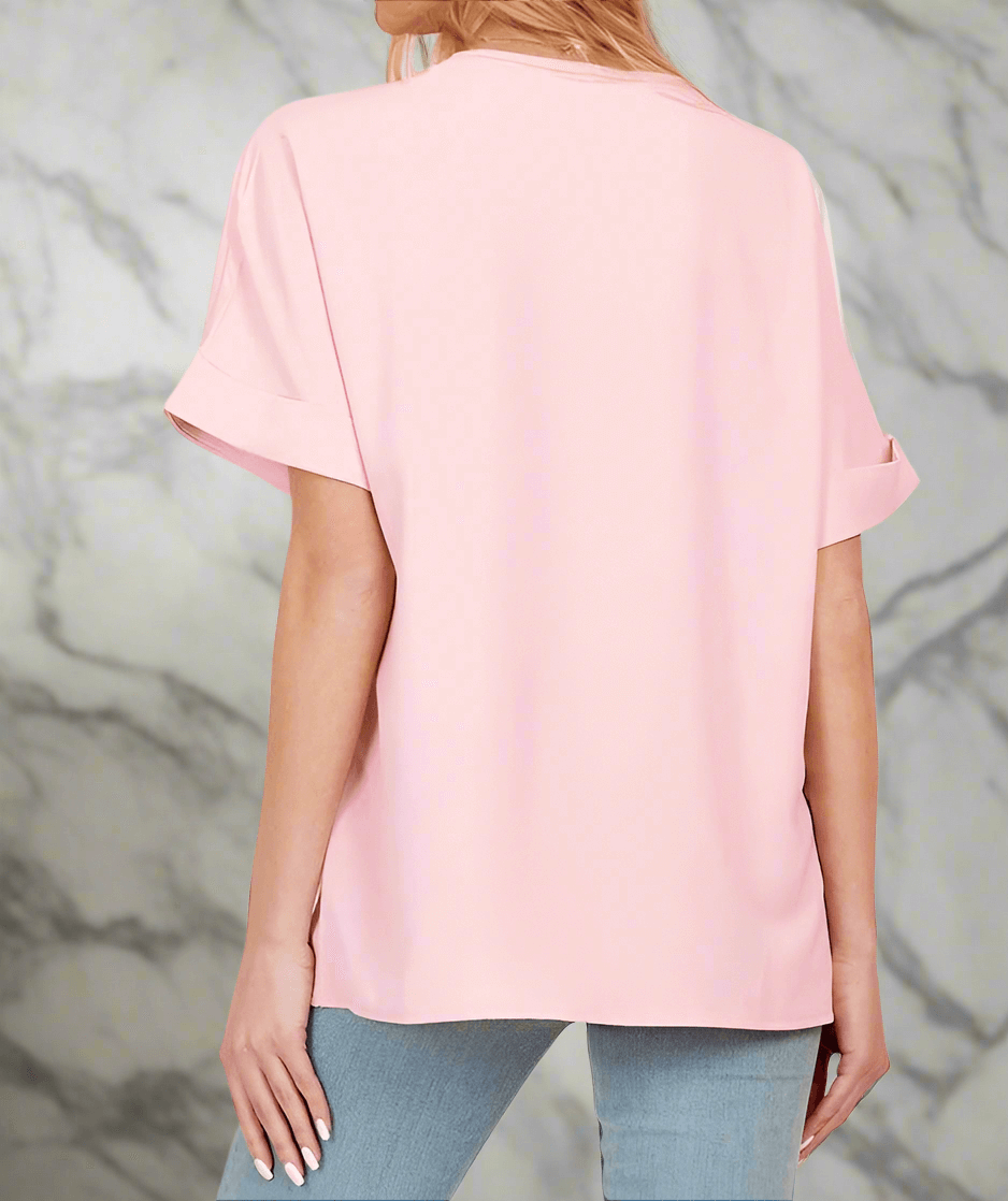 Back view of the pink DAYBREAK DARLING Top showcasing relaxed short sleeves and smooth finish.