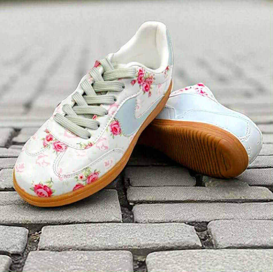 Floral printed vintage sneakers with mint laces and gum soles, perfect for stylish weekend outings.