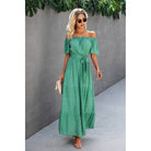 Off shoulder green polka dot maxi dress with waist tie, perfect for casual outings and vacations.