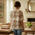 SOFT STRUCTURE TOP - She + Sky showcased on a model in a cozy indoor setting, highlighting its beautiful neutral pattern.