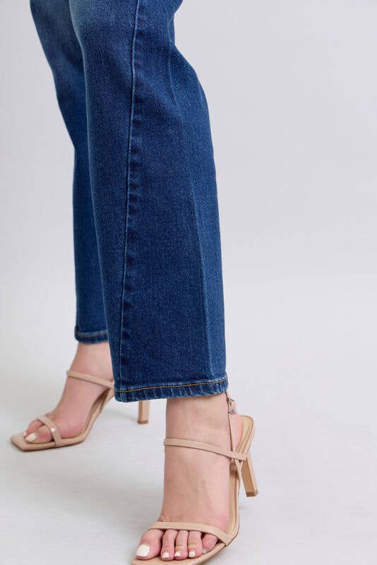 Close-up of woman wearing JUDY BLUE - NOELLE JEANS with stylish high-heeled sandals, showcasing the wide leg and dark wash denim.