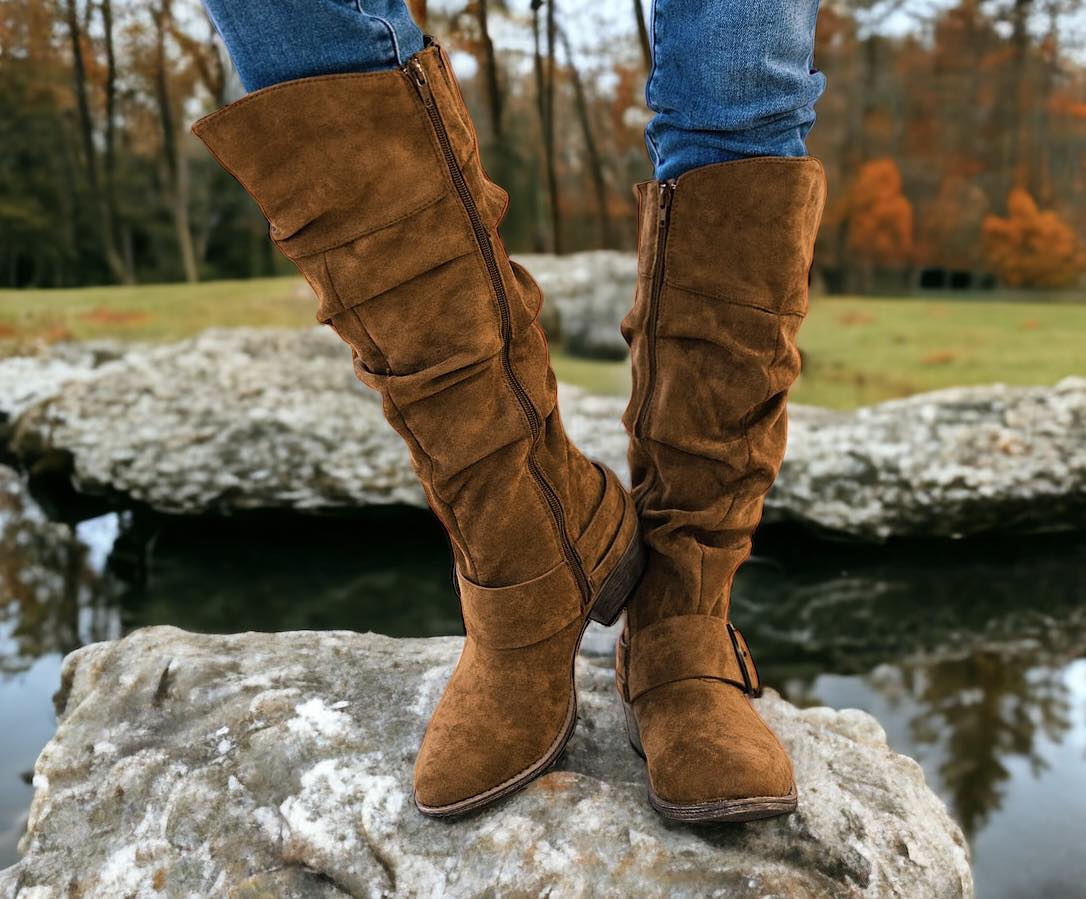 BLITZ BOOTS in Copper By Very G by Very G $44.00 Strut in style with Very G's Women's Blitz Boot in a gorgeous copper color!! Enjoy comfy cushioning while you turn heads with every move. Don this sleek suede-esque stunner with the glossy silver buckle for