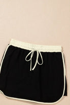 Black drawstring skort with white trim, part of the Boardwalk Breeze Skort Set, ideal for sporty and casual outfits.