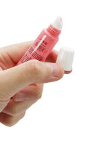 Strawberry Scented Gel Lip Balm Squeeze Tube - 36 Pcs held in a hand, showcasing the tube and cap.