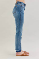 Side view of JUDY BLUE - AVERY JEANS in light blue with mid-rise fit and relaxed boyfriend cut.
