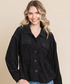 Women wearing black embossed soft casual shacket with dolman sleeves and button-down front, perfect for layering.