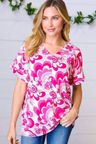 Magenta and white geometric floral V neck top with banded short sleeves, perfect for casual outfits.