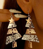 Two-tone Christmas tree dangle earrings by Vivian-Lu, featuring shiny metal shapes and festive star accents.