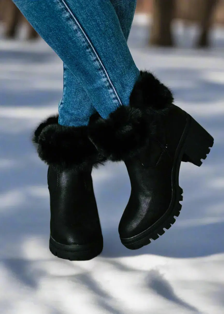 Cozy Very G North Park fur-lined black boots, stylishly paired with jeans, perfect for winter fashion.