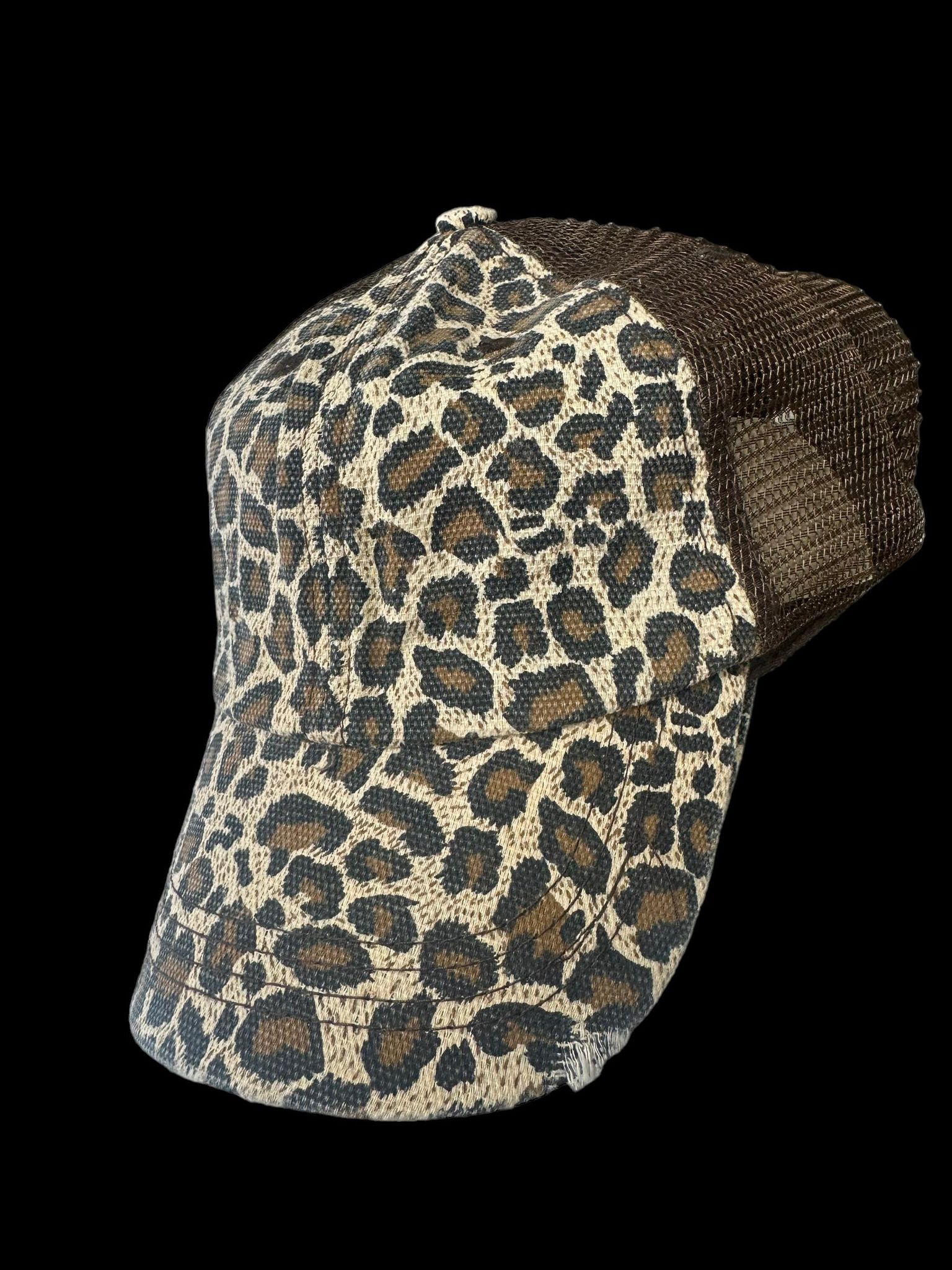 Leopard print trucker hat with a low profile fit and mesh back for stylish comfort.