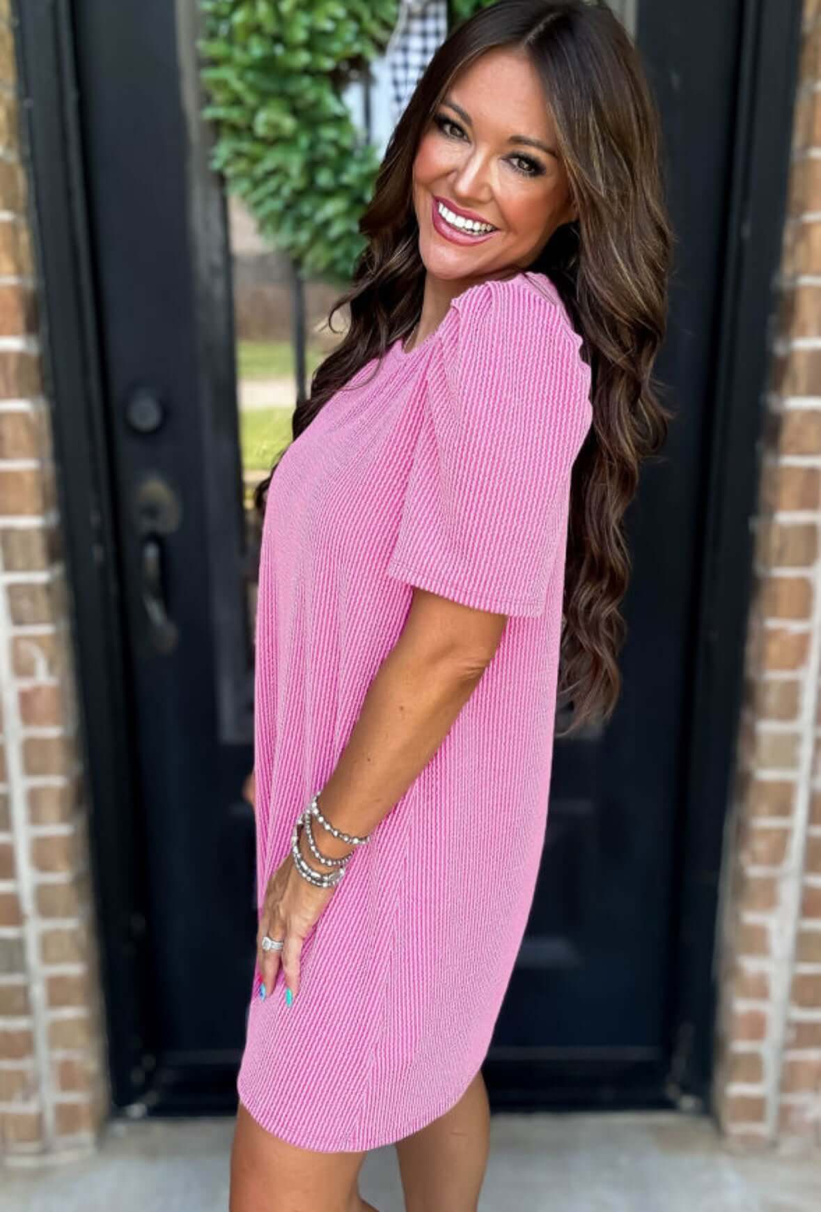 Model wearing Carefree Spirit Dress in rose pink, showcasing its relaxed fit and short puff sleeves.