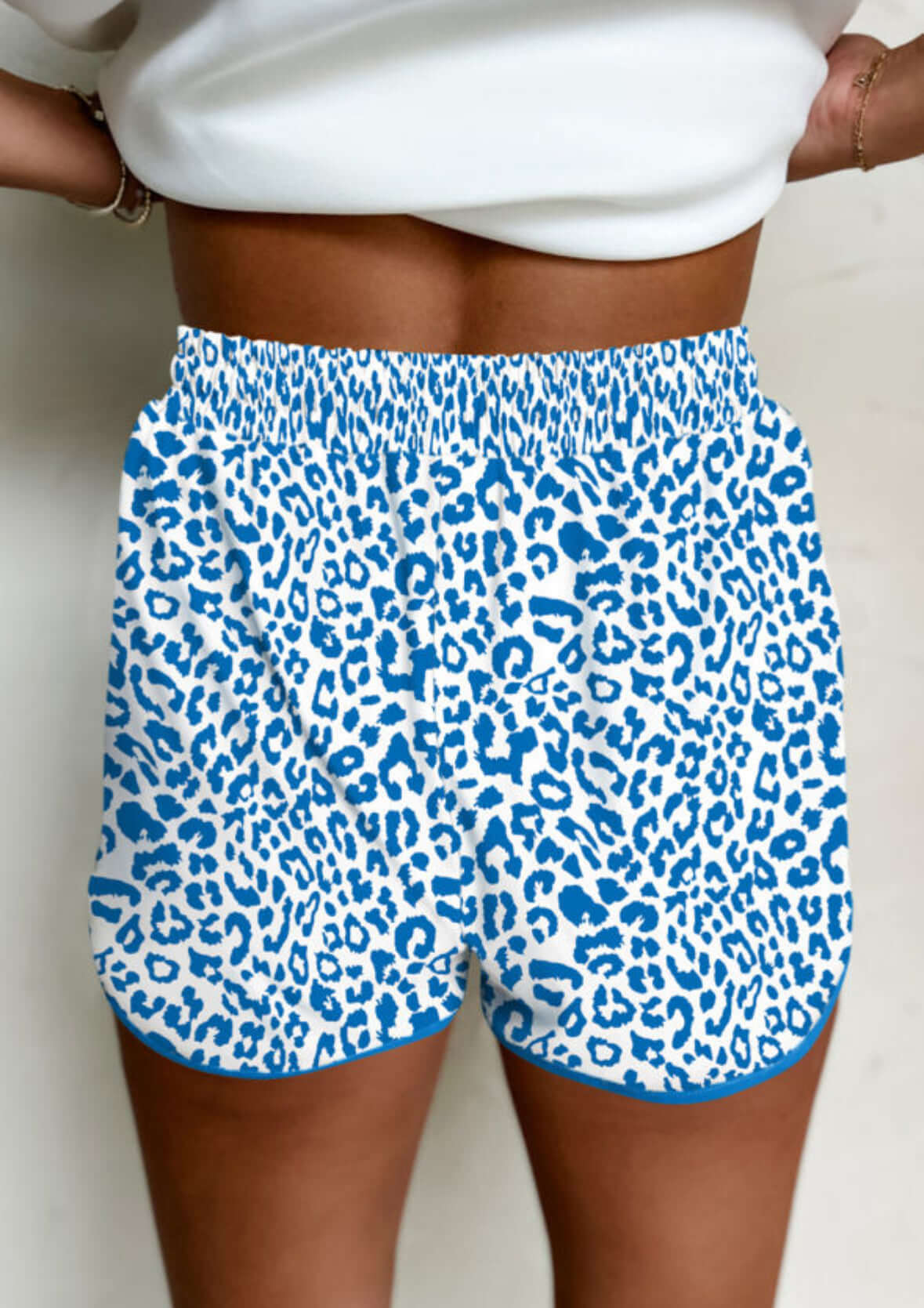 Close-up of blue leopard print shorts, perfect for casual wear and summer activities.