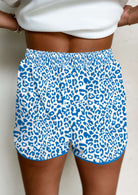 Close-up of blue leopard print shorts, perfect for casual wear and summer activities.