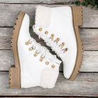 FIRST SNOW ANKLE BOOTS by Not Rated by Not Rated by Naughty Monkey $40.00 These First Snow Ankle Boots in Artic White by Naughty Monkey are a stylish addition to any winter outfit. With a cute lace up design and faux fur trim, they add a touch of pizazz t