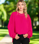 COSMO CUTIE - Cotton Bleu by Cotton Bleu $20.00 Add a pop of bright color to your wardrobe with this fuchsia top. With the ladder trim at the neck and cuffs, it's both cute and elegant. Plus, the keyhole closure in the back adds an extra touch of charm. P