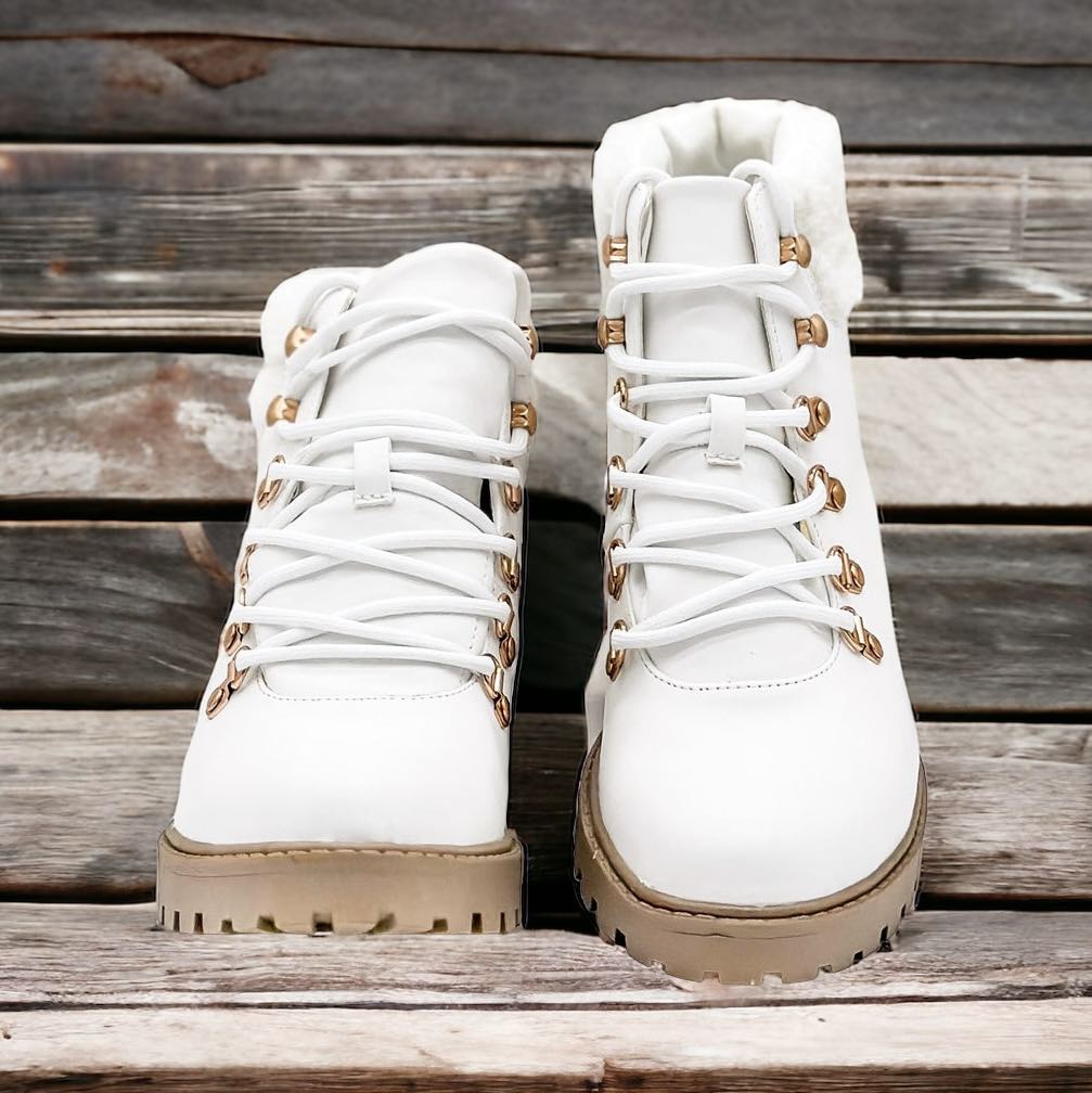 FIRST SNOW ANKLE BOOTS by Not Rated by Not Rated by Naughty Monkey $40.00 These First Snow Ankle Boots in Artic White by Naughty Monkey are a stylish addition to any winter outfit. With a cute lace up design and faux fur trim, they add a touch of pizazz t