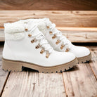 FIRST SNOW ANKLE BOOTS by Not Rated by Not Rated by Naughty Monkey $40.00 These First Snow Ankle Boots in Artic White by Naughty Monkey are a stylish addition to any winter outfit. With a cute lace up design and faux fur trim, they add a touch of pizazz t