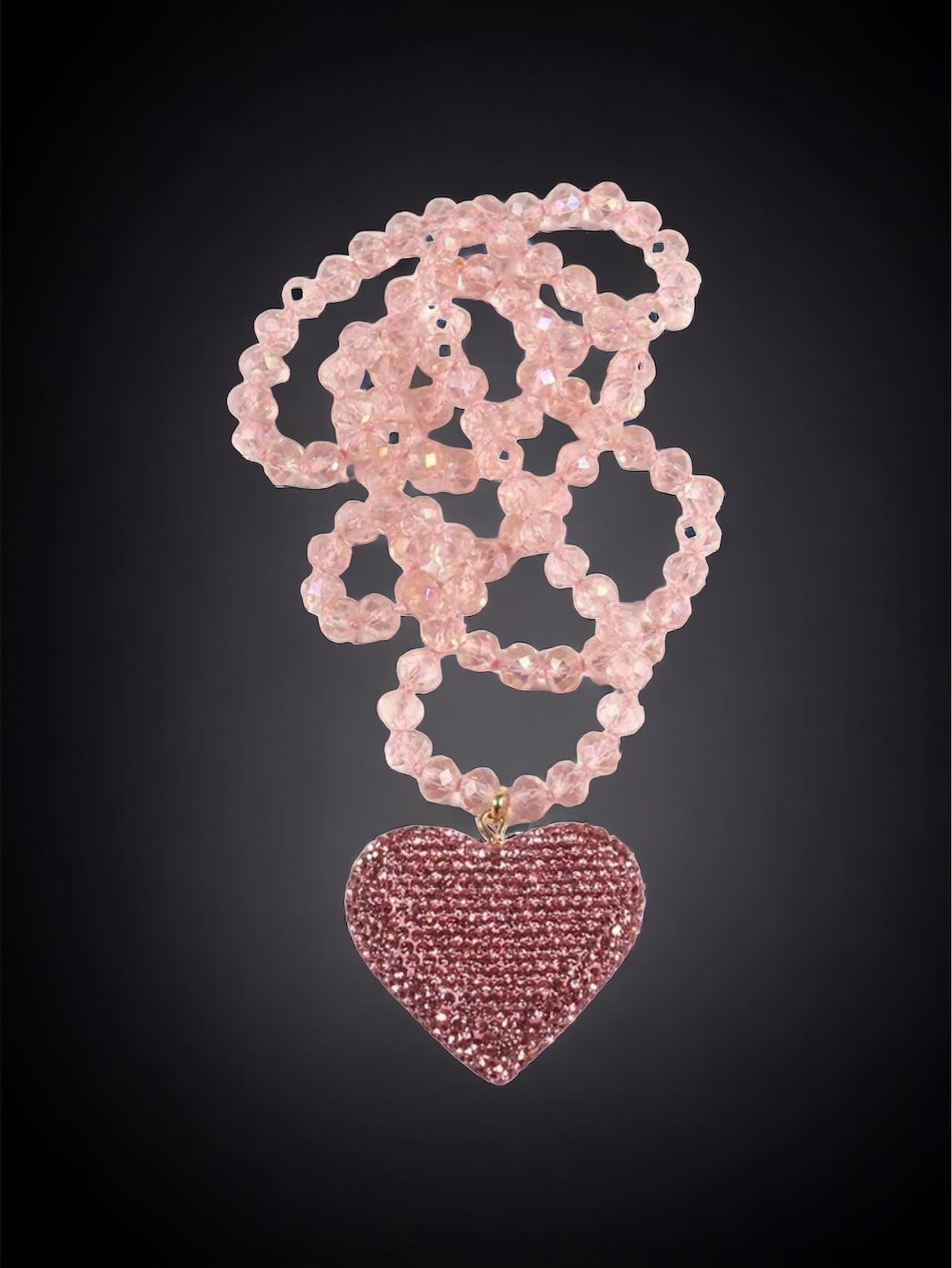 HEART STRINGS Necklace by Teal Tiger Boutique $8.00 Add some sparkle to your outfit with the HEART STRINGS Necklace! Featuring vibrant rhinestone hearts in pastel pink and rose red, this necklace adds a touch of romance to any look. The long strand of bea