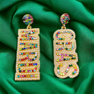 MARDI GRAS earrings with colorful rhinestones on a vibrant green background, celebrating New Orleans culture.