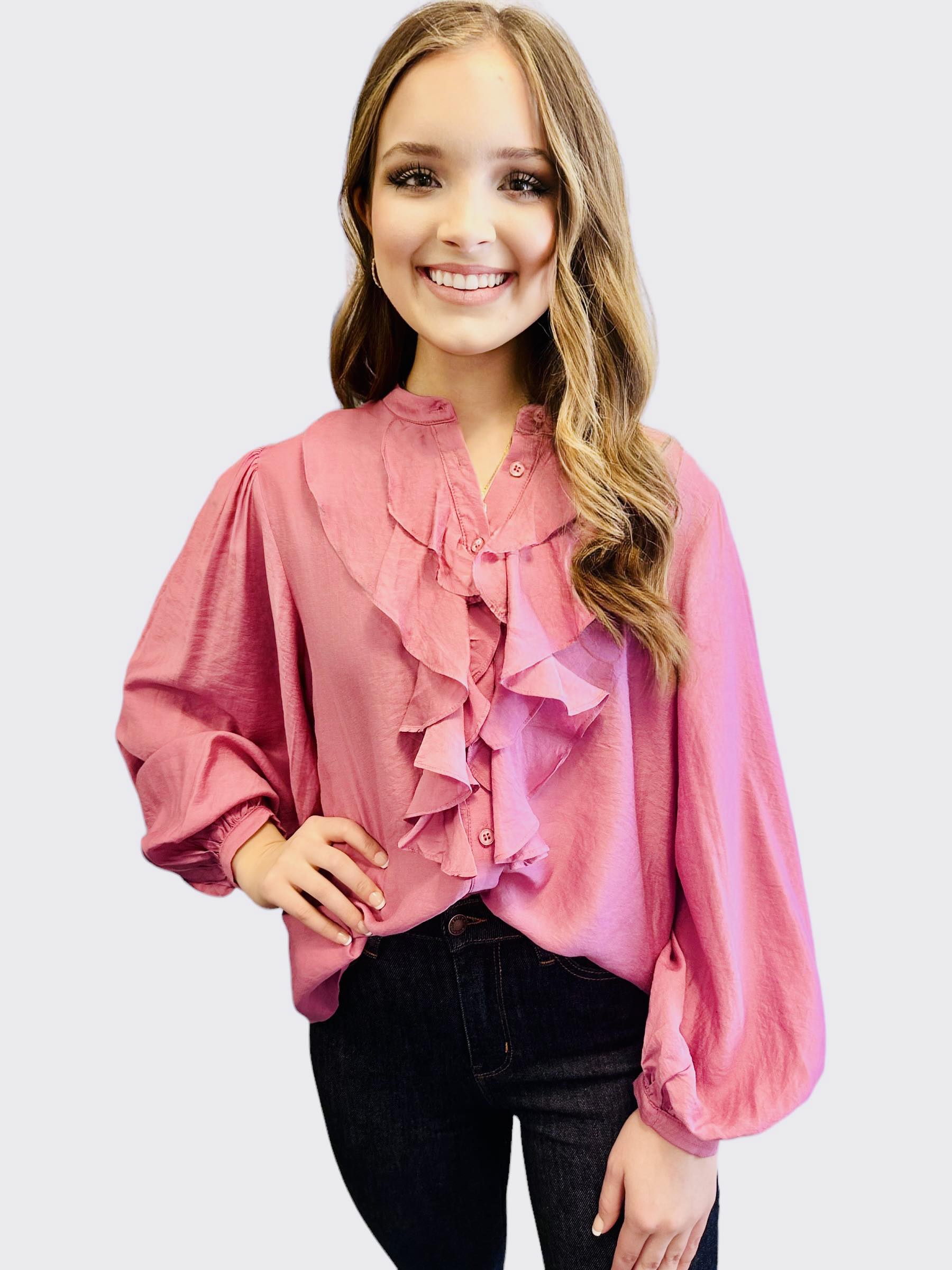 FOUND MY FRILL Top - Easel by Easel $20.00 This silky smooth button-up top exudes luxury, with an abundance of charming ruffle accents. All in a charming shade of pink. By Easel 90% Rayon, 10% Polyester Teal Tiger Boutique