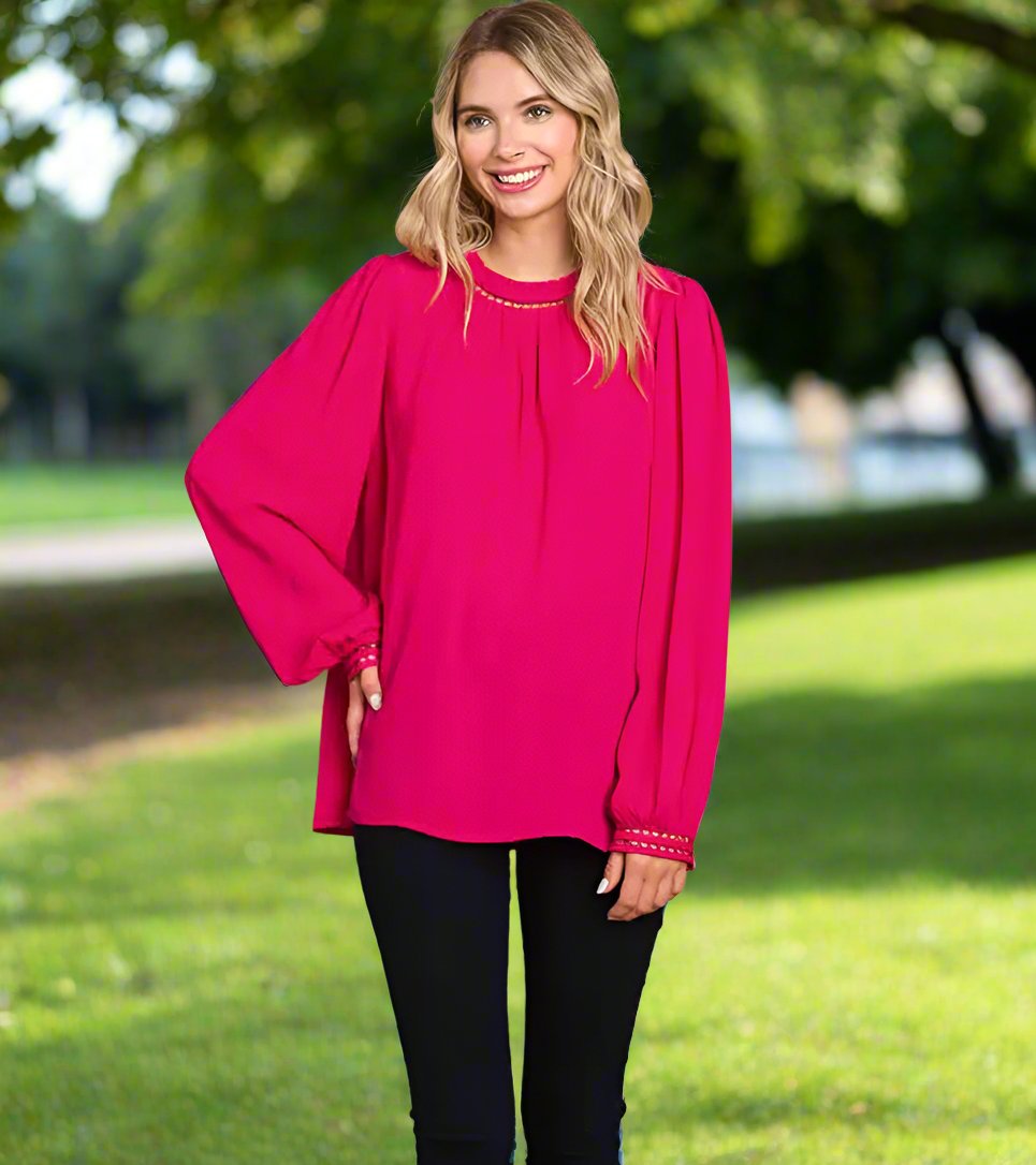 COSMO CUTIE - Cotton Bleu by Cotton Bleu $20.00 Add a pop of bright color to your wardrobe with this fuchsia top. With the ladder trim at the neck and cuffs, it's both cute and elegant. Plus, the keyhole closure in the back adds an extra touch of charm. P