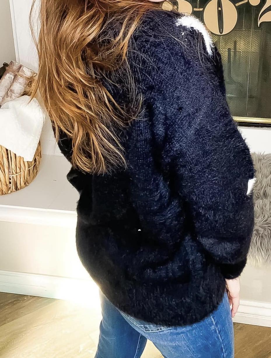 RISING STAR Sweater by Teal Tiger Boutique $20.00 Indulge in luxurious comfort with our ultra soft teddy bear sweater adorned with delicate stars. This premium piece offers a true to size fit and unparalleled softness. Choose from our classic black or ele